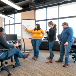 An image showcasing a diverse group of coworkers gathered around a standing desk chair, engaged in animated conversation and collaborative problem-solving