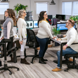 An image showcasing a diverse group of employees gathered around standing desk chairs, engaged in lively conversations and active collaboration